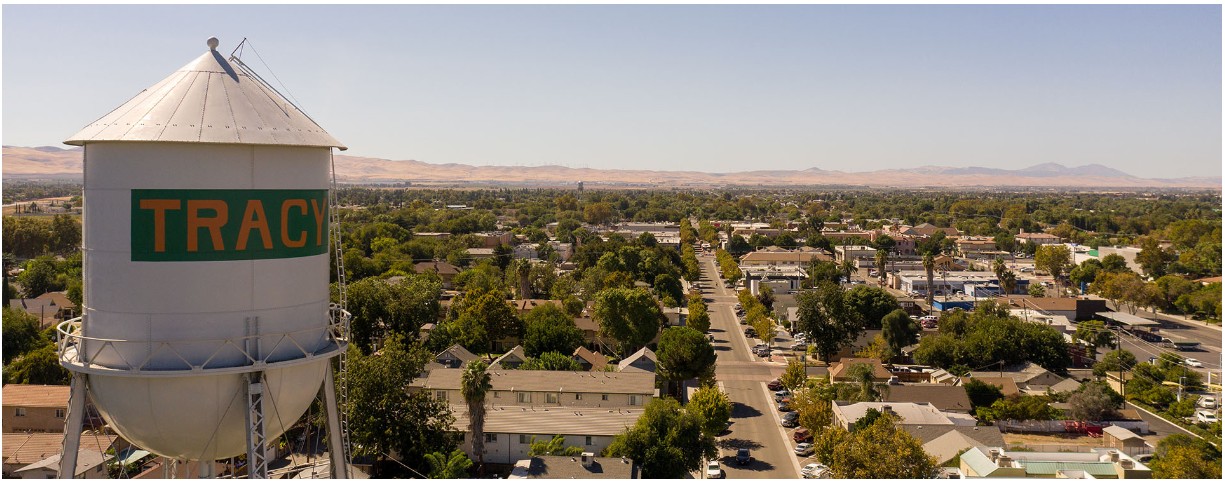 The Tracy water tower above downtown, with the hills behind